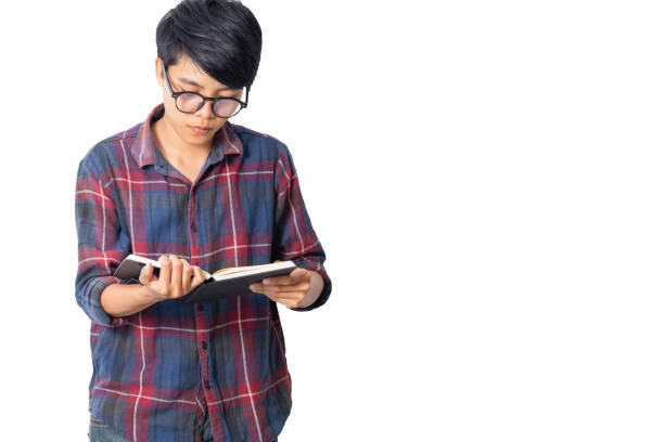 istock Asian man in plaid shirt reading a book isolated white background 1034937754