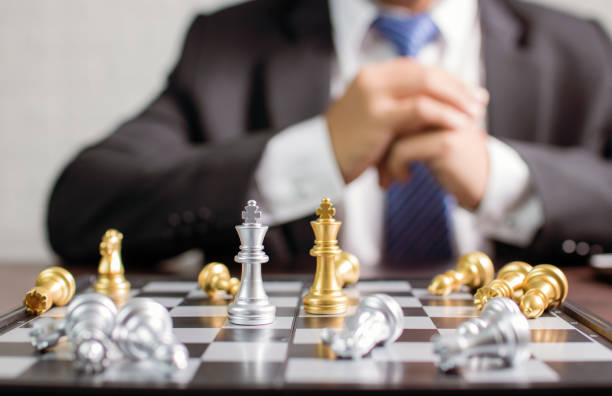 istock businessman planning to move chess 1034961034
