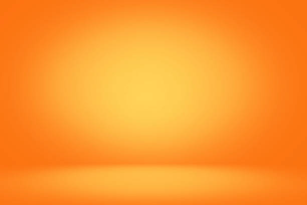 istock Yellow and orange studio backdrop and horizontal banner background 1034961096