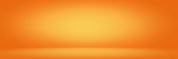 istock Yellow and orange studio backdrop and horizontal banner background 1034961104