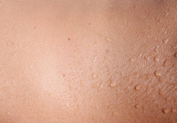 Wet skin Wet human skin as background medicine and science drop close up studio shot stock pictures, royalty-free photos & images