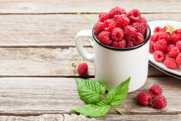 istock Cup of ripe raspberries 1034967494