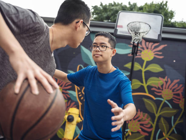 istock Twins at basketball 1034972308