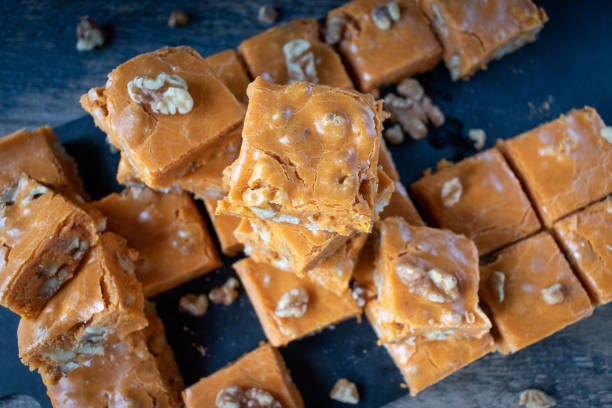 istock Pumpkin fudge squares with walnuts in cute Halloween setting 1034974208
