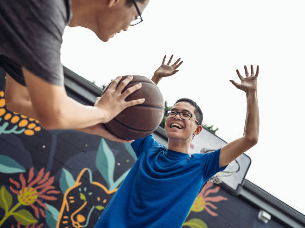 istock Twins at basketball 1034974476
