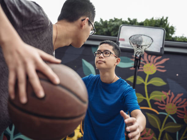 istock Twins at basketball 1034975206