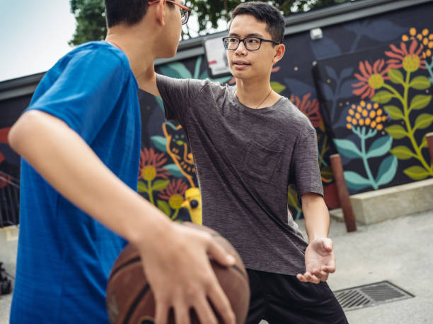 istock Twins at basketball 1034975880