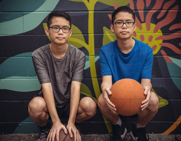 istock Twins at basketball 1034976122