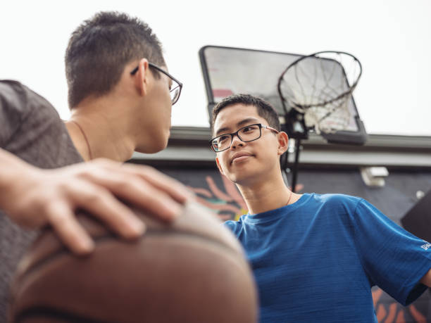 istock Twins at basketball 1034976330