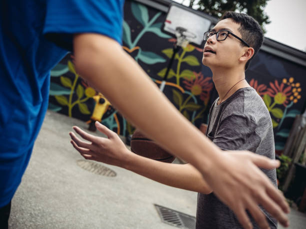 istock Twins at basketball 1034976596