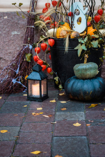 istock Autumn mood, lantern and yellow fallen leaves 1034980014