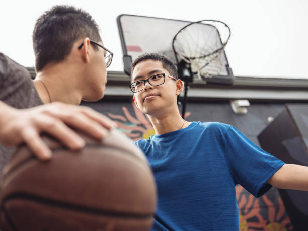 istock Twins at basketball 1034980024