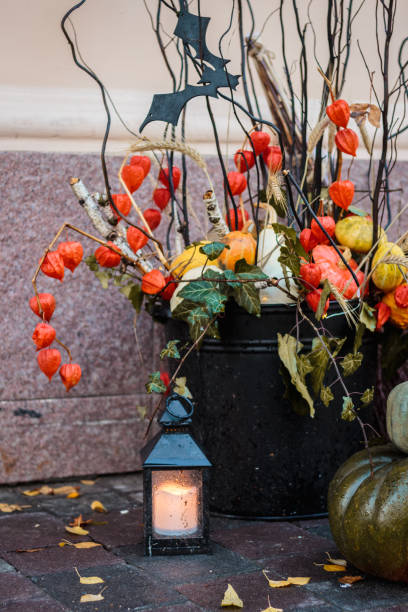 istock Autumn mood, lantern and yellow fallen leaves 1034980132