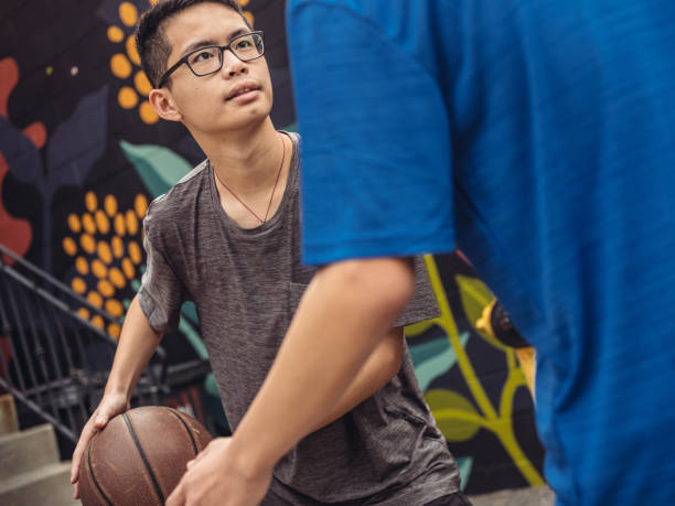 istock Twins at basketball 1034980360