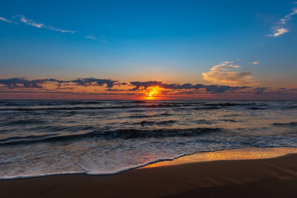 istock Bright colorful sunrise on the seashore 1034980698