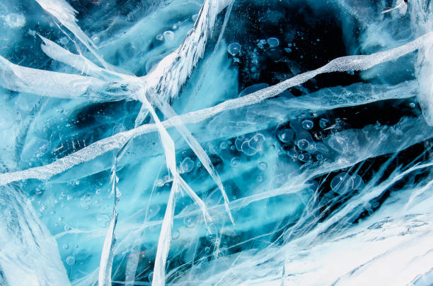istock Blue cracked surface of the ice surface 1034980760