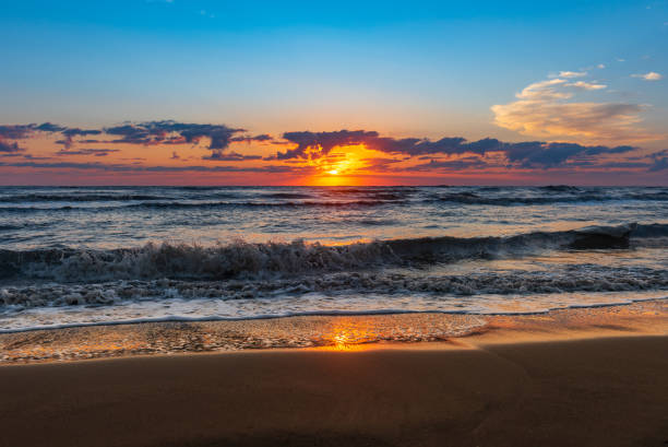 istock Bright colorful sunrise on the seashore 1034980792