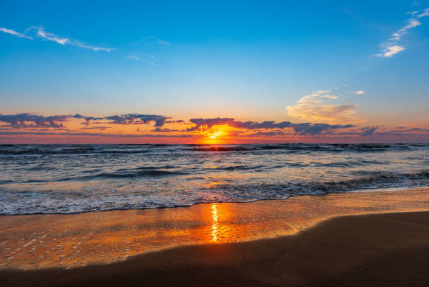 istock Bright colorful sunrise on the seashore 1034980886