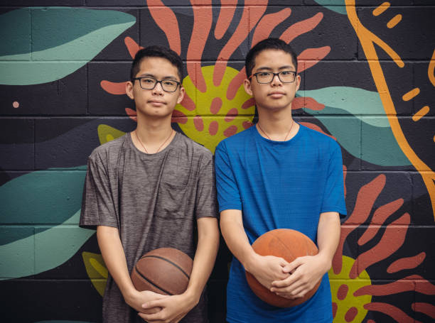 istock Twins at basketball 1034981254