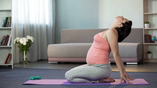 istock Female waiting for baby sitting on mat, feeling babys response after training 1034982622
