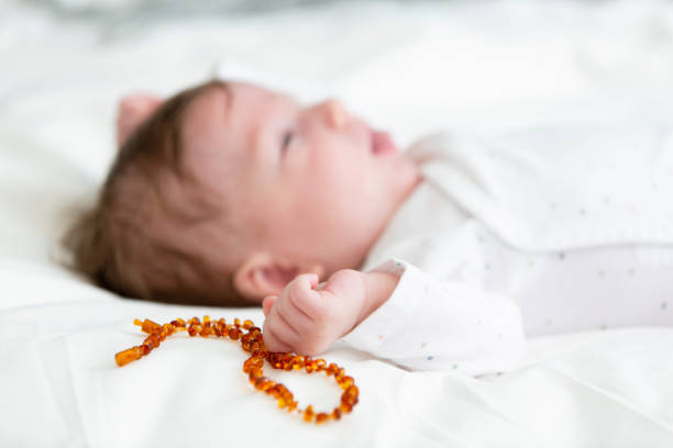 istock Cute Baby Lying On Bed 1034982990