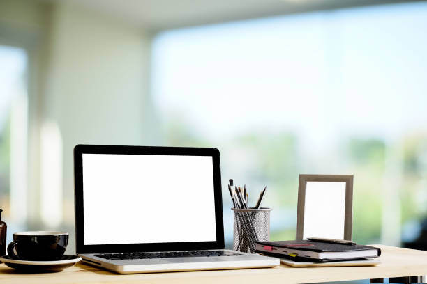istock mockup office computer on desk with coffee cup ,notepad and photo frame, office workspace concept. 1034985640