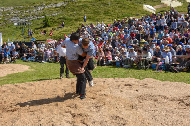 Engstlenalp, Switzerland - 4 August 2018: Two Swiss taking part in a traditional wrestling match (called 'Schwingen') at Engstlenalp on the Swiss alps