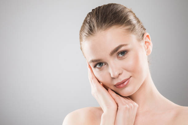 istock Young woman with clean fresh skin 1034986266