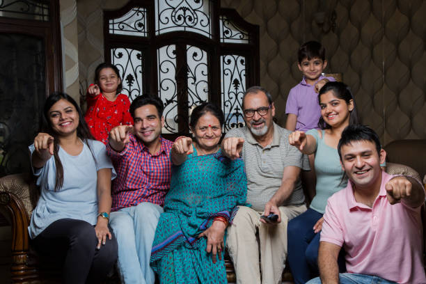 istock Cheerful Multi Generation Family enjoying at home. - Stock image 1034987366