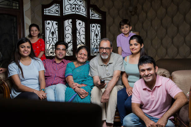 istock Cheerful Multi Generation Family enjoying at home. - Stock image 1034988282