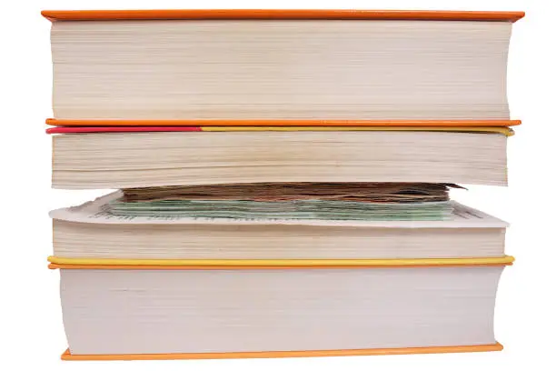 Photo of Hide money between book pages