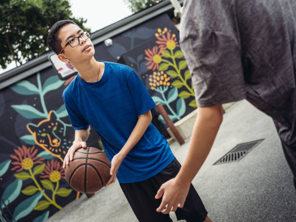 istock Twins at basketball 1035006978