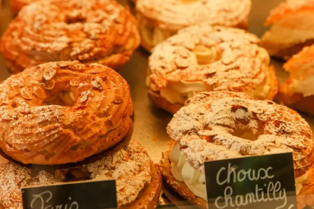 Paris-brest french cake with cream at the patisserie shop in France