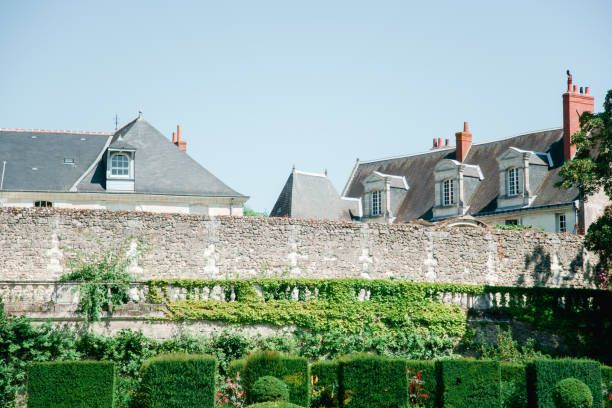 istock French traditional building with classical garden with geometrical forms. French architecture concept 1035008436