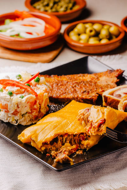 istock Christmas dish in Venezuela, hallaca, ham bread, salad and pork 1035011794