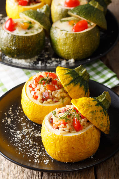 istock Baked zucchini stuffed with bulgur, meat, cheese and vegetables close-up. vertical 1035013426