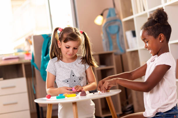 istock Preschoolers playing with colorful plasticine 1035018416