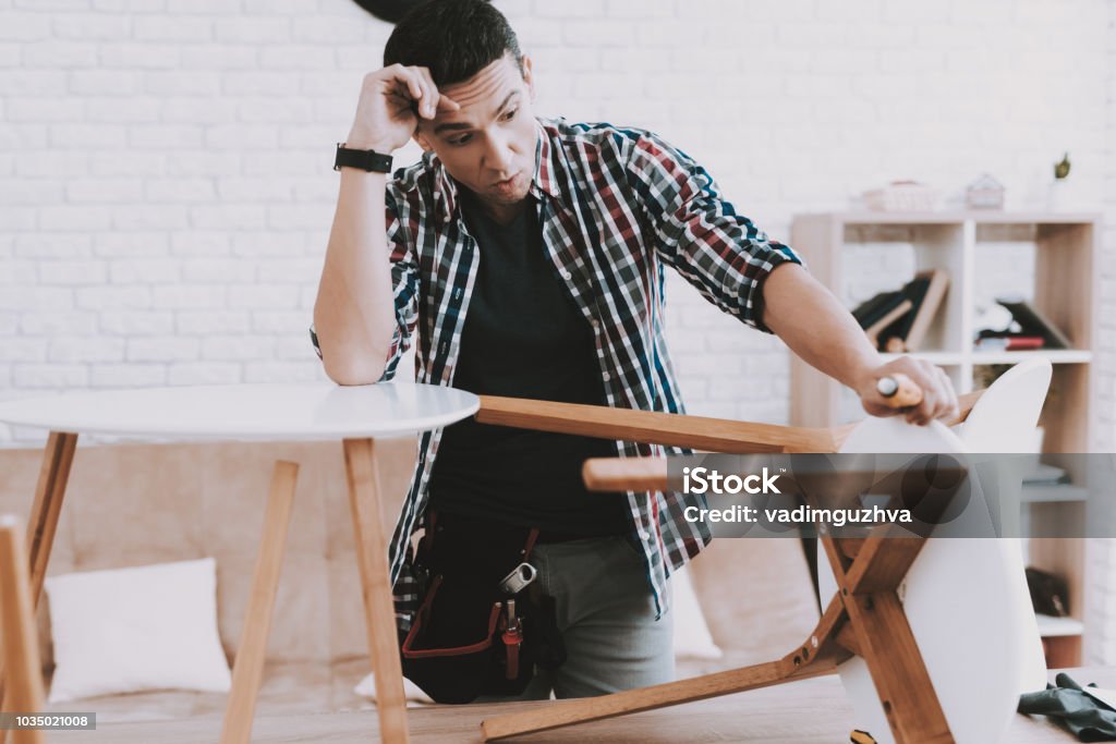 Man Making Small Square Table Young Man Assembling Coffee Table And Stools Stock Photo - Download ...