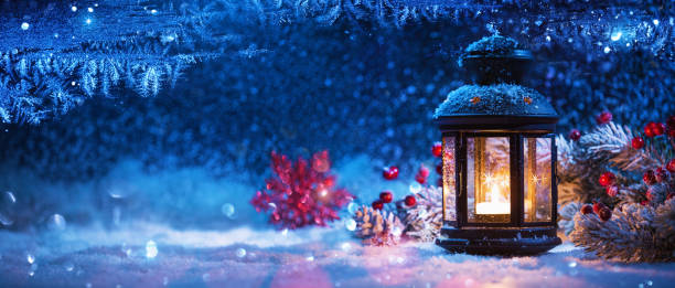 istock Winter Decoration with a Candlestick Near the Snow-Covered Windo 1035025378