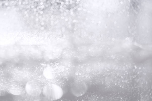 istock A glittering Christmas white background with bokeh. Blurred abstract background. 1035025618