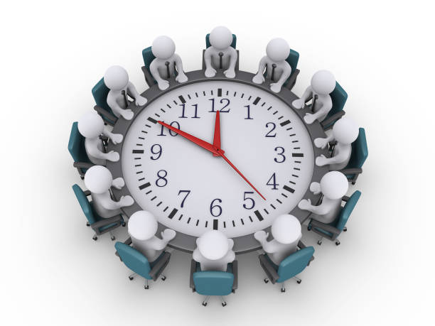 istock Meeting of businessmen around a clock-table 1035027432