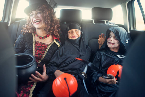 istock Dressed up kids on their way to Halloween party 1035029476