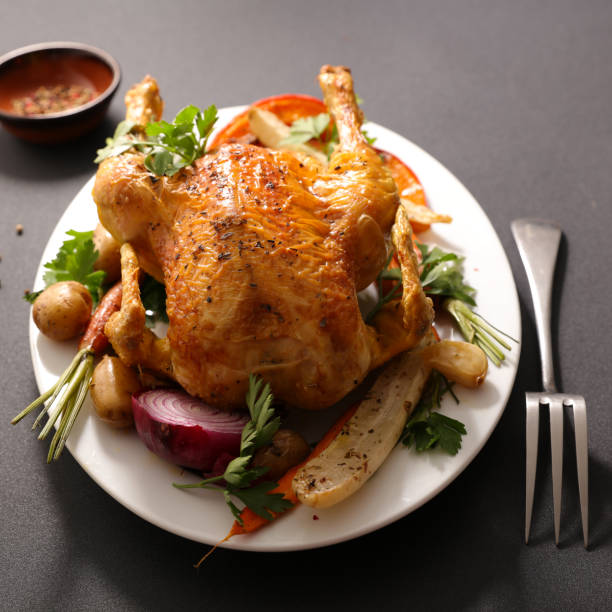 istock baked chicken and vegetable 1035038322