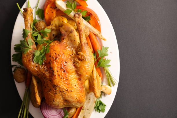 istock baked chicken and vegetable 1035038364