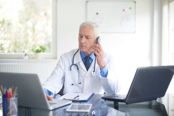 istock Male doctor making call 1035038730