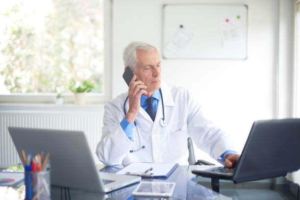 istock Male doctor making call 1035038742