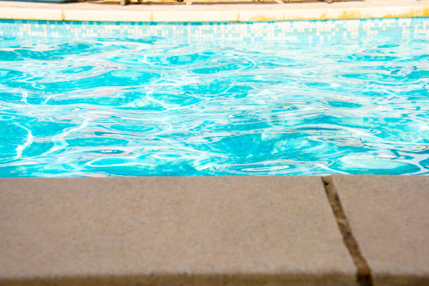 istock Ripple Water in swimming pool witn sun reflection 1035047998