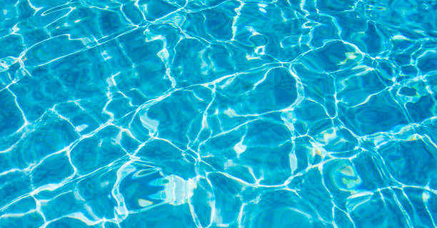 istock Ripple Water in swimming pool witn sun reflection 1035048980