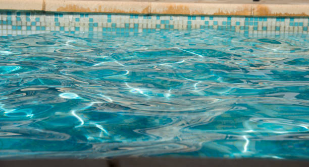 istock Ripple Water in swimming pool witn sun reflection 1035053092