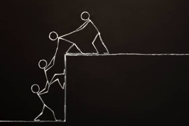 istock Team Helping Each Other To Achieve Success Together 1035057188